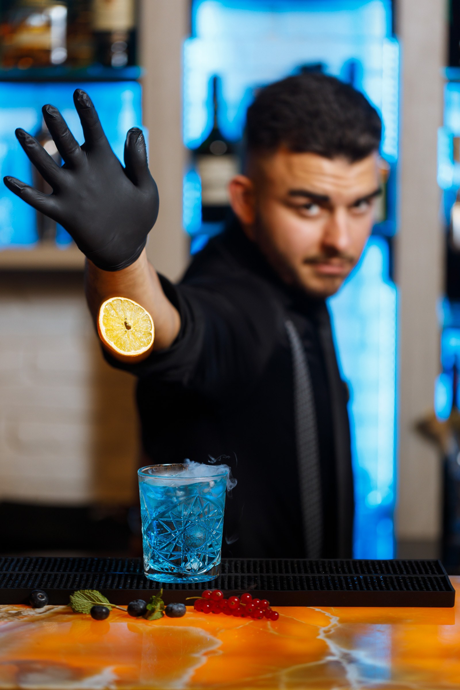 Denis presenting a smoked blue gin cocktail